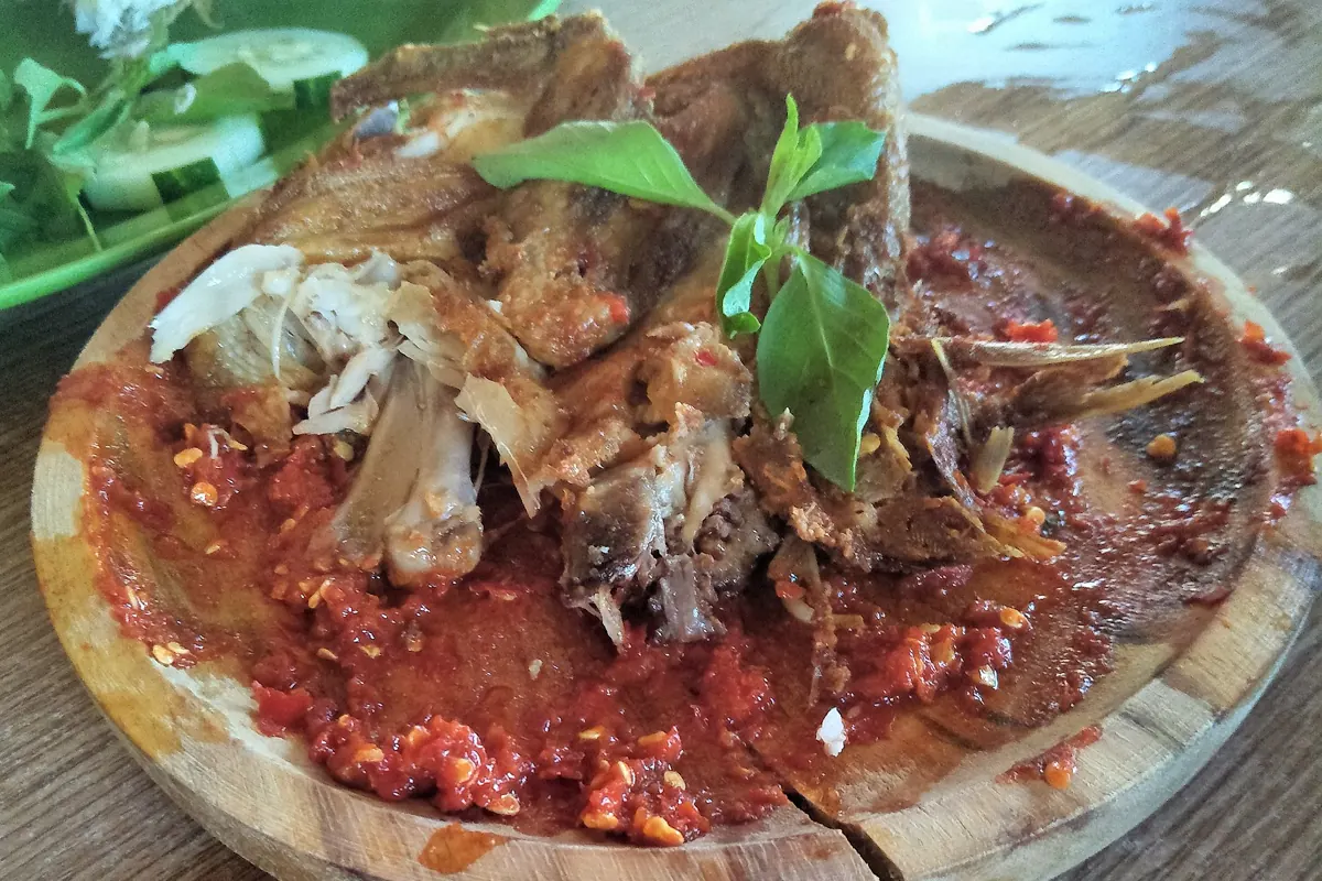 Ayam penyet with smashed fried chicken and spicy sambal