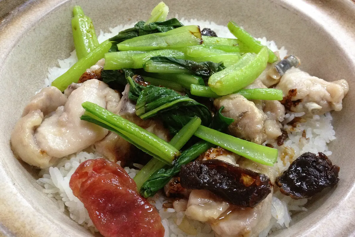 Singapore claypot chicken rice with sausage, greens and dark soy sauce